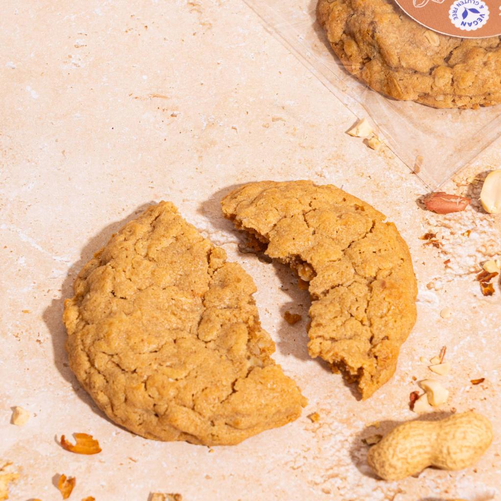 A peanut Butter vegan gluten free cookie broken in half