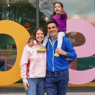 The whole family in front of the shop