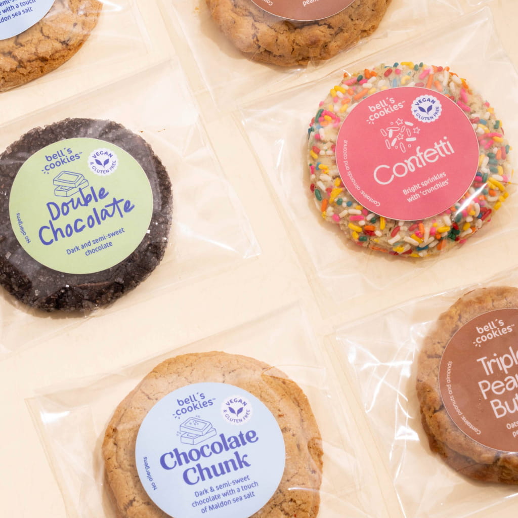 The vegan gluten free box with three piles of cookies