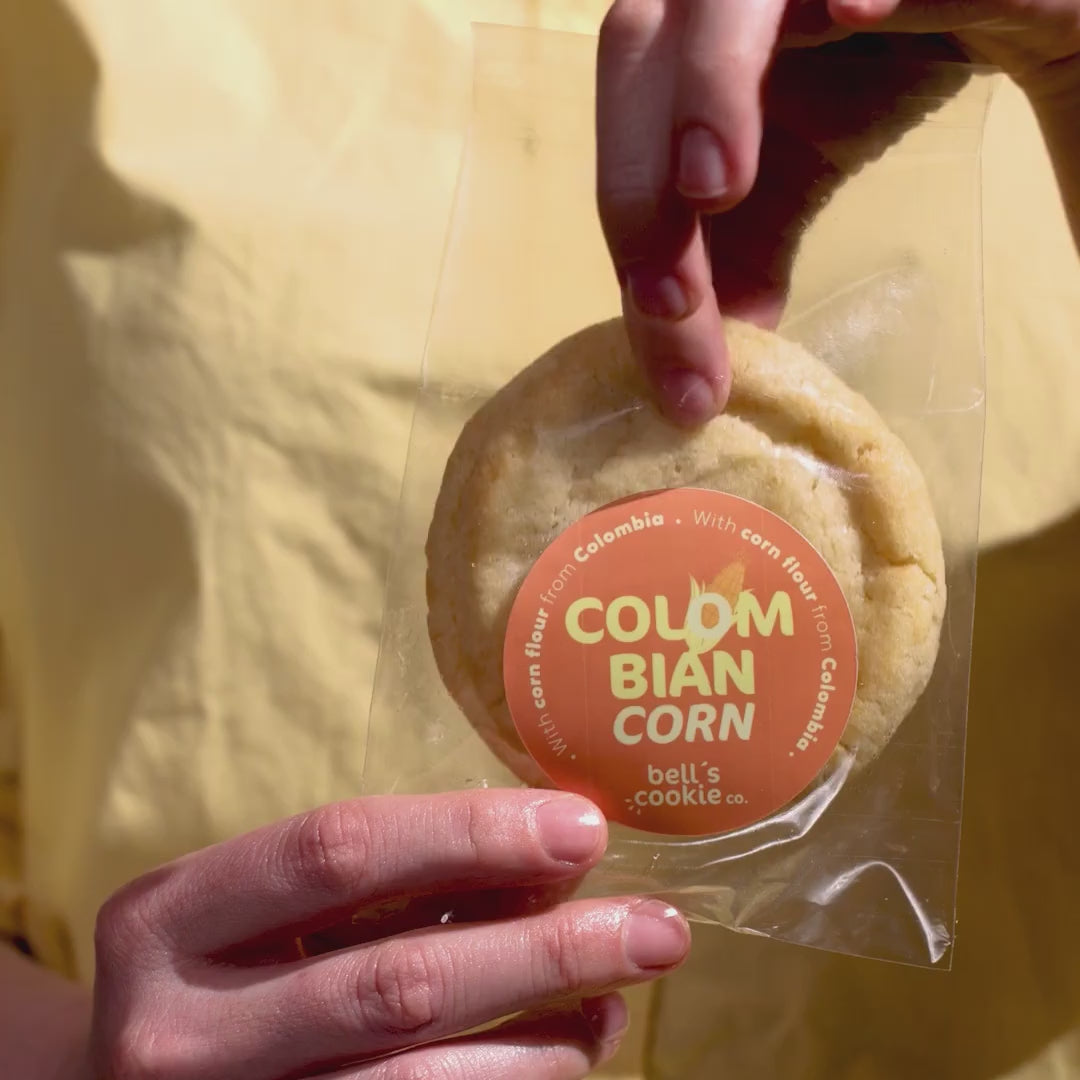 TAKING A COLOMBIAN CORN COOKIE OUT OF THE PACKAGING